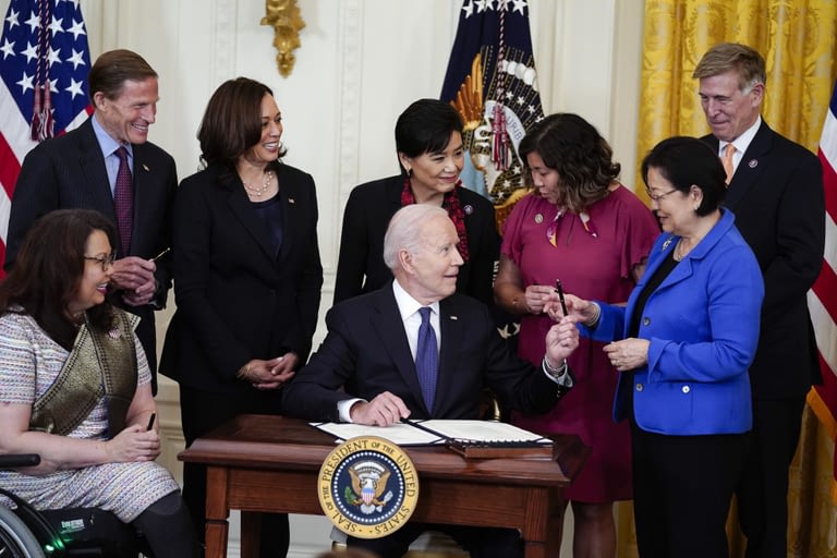 Biden signs law to combat hate crimes against Asian Americans